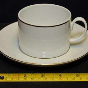 dishes, plates and china for rent in birmingham, al shown is a white with gold trim coffee cup and saucer