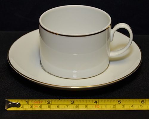 dishes, plates and china for rent in birmingham, al shown is a white with gold trim coffee cup and saucer
