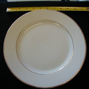 dishes, plates and china for rent in birmingham, al shown is a white with gold trim dinner plate