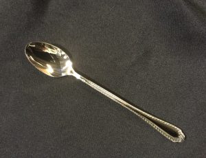fiori pattern stainless flatware for rent. shown is an ice tea spoon